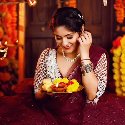 A candid moment from our Diwali themed shoot. The makeup features a soft smokey eye and a warm, glowing base, perfect for the festival of lights.