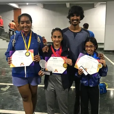 A group of our successful players with their coach after a great performance. We celebrate wins in the U12 and U14 girls categories, a result of teamwork between players, parents, and coaches.