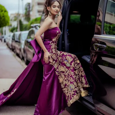 The arrival. Anushka Sen stepping out for the Cannes red carpet in a custom-designed purple gown featuring a structured bow and an elegantly embroidered train. This celebrity red carpet styling was all about creating a memorable debut.