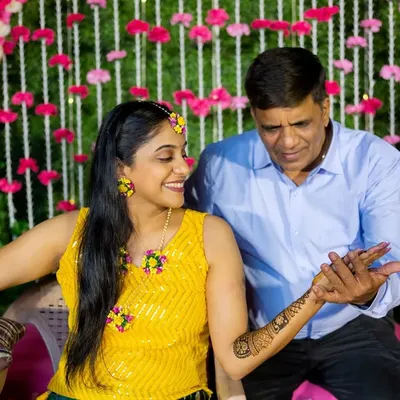 Capturing a sweet, candid moment between a bride-to-be and her father during her Mehendi ceremony. My event photography focuses on these genuine interactions that tell the story of your celebration.
