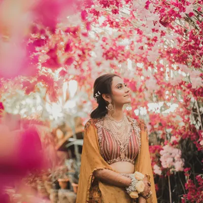 A bride framed by blossoms, looking towards her future. Our bridal portrait sessions are about more than just a beautiful photo; they are about capturing the soul of the woman at the heart of the story.