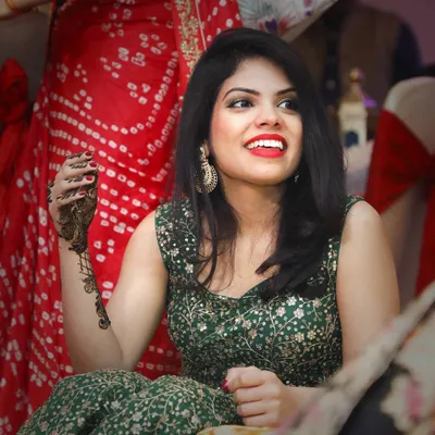 A beautiful, candid smile during a wedding function. My approach is to find these genuine expressions, capturing the joy of the celebration without interrupting the moment.