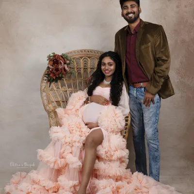 A beautiful family portrait in the making. This couple looks radiant and happy as they prepare to welcome their new addition.
