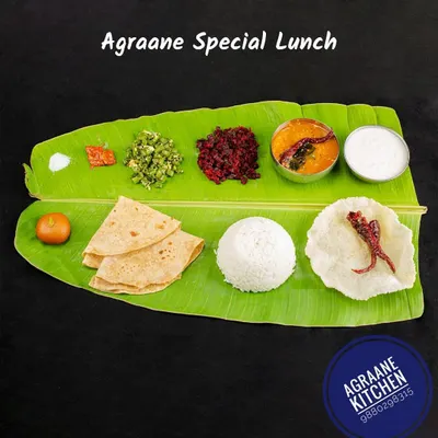A beautifully presented homemade lunch on a banana leaf. This Agraane special meal is healthy, tasty, and feels just like home. It is available for delivery.