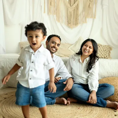 This little boy is the center of his parents' world, and his energetic presence brings so much joy to the photo. I love capturing these unposed moments where the family is just enjoying each other.