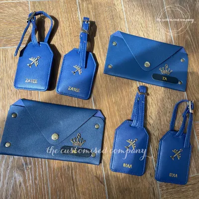 For the jetsetter, the honeymooner, or the weekend explorer. This coordinated travel set in royal blue includes personalized passport wallets and luggage tags, marrying function and flair.