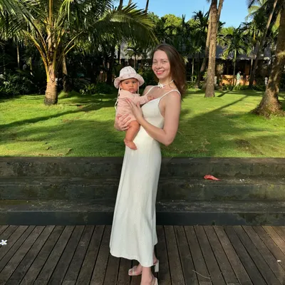 Holding my daughter, Emi. I used to see motherhood as an obstacle to my practice and travels, but now I only want to share this beautiful world with her.