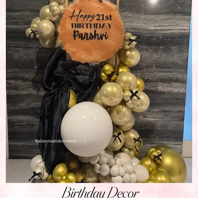 A chic and modern decor piece for a 21st birthday. I used a sophisticated palette of gold, black, and white balloons, with a custom-painted acrylic sign for Parshvi's celebration.