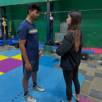 Our coach discussing performance metrics with a player after a session using Firstbeat technology.