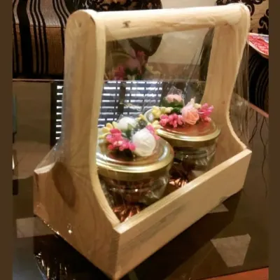 This handcrafted wooden box with a handle is one of my signature items. It can be filled with customizable chocolate jars and is perfect for any occasion.
