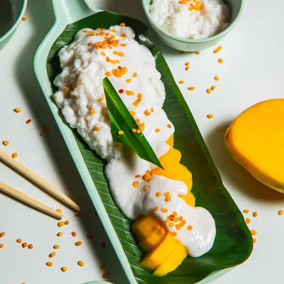 A classic Thai dessert, our Mango Sticky Rice is the perfect sweet finish. It features sweet, glutinous rice steamed with coconut milk, served alongside fresh, ripe mango slices and drizzled with a creamy coconut sauce.
