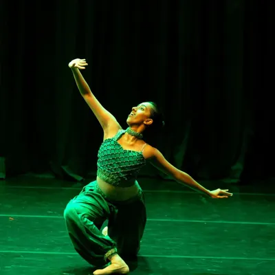 A striking solo moment from a rehearsal for our "Aladdin" production. This image captures the magic and character of the Emerald from the Cave of Wonders.