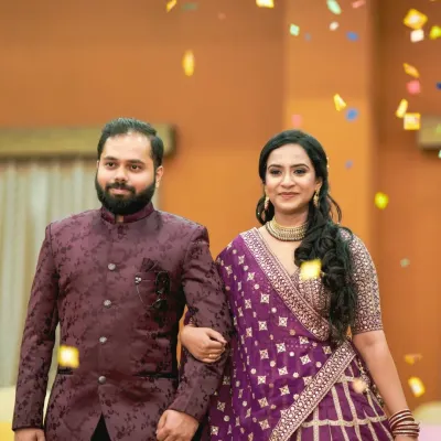 The grand entrance of the couple at their engagement function, showered with confetti. We capture the celebratory atmosphere and excitement of this key moment.