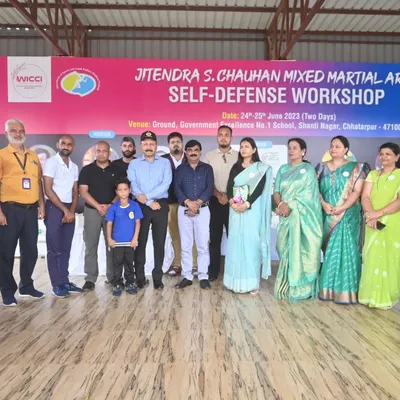 Posing with esteemed members of the organizing team for the JSC Mixed Martial Arts for Self-Defense workshop.