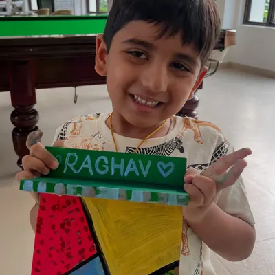 A happy student with the personalized nameplate he created as a gift. Handmade presents are the best!