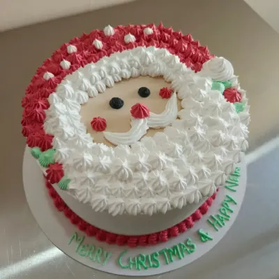 Here is another look at my popular Santa Claus themed cake. I can customize the message on the board, like this one wishing a "Merry Christmas & Happy New Year".