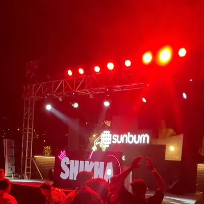 The stage is my home. A blurry but memorable shot from my set at Sunburn Festival, with the iconic logo lit up behind me.