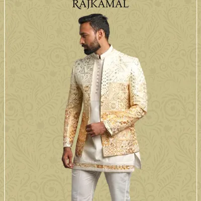A model showcasing a stunning golden Indo-Western jacket layered over a simple kurta. The sequin work and bandhgala collar make this a perfect outfit for a sangeet or wedding celebration.