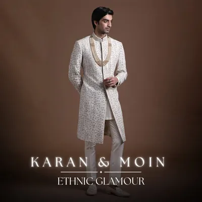 This ivory sherwani is the epitome of ethnic glamour. It blends Western tailoring for a clean silhouette with traditional fabrics and intricate handwork, offering a modern fusion of comfort and elegance for the groom.