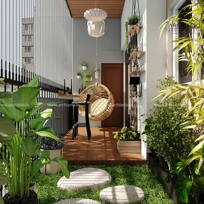 A cozy balcony transformed into a green oasis. This design features a hanging swing chair, stepping stones on artificial grass, and plenty of planters to bring nature into your home.