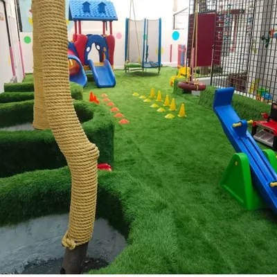 This indoor children's activity center uses our artificial turf to create a safe and engaging play surface. The soft, cushioned grass minimizes the risk of injury from falls and provides a clean, allergen-free environment.