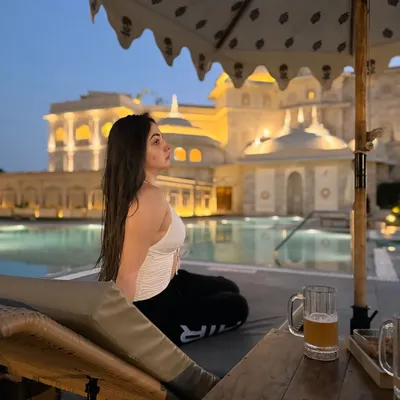 Relaxing by the stunning pool at Fairmont Jaipur as the palace lights up at dusk. This is the kind of luxurious, tranquil moment I love to capture for my audience.