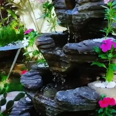 A close up of a small rock waterfall we installed. The sound of flowing water adds a very calming feeling to any garden, big or small.