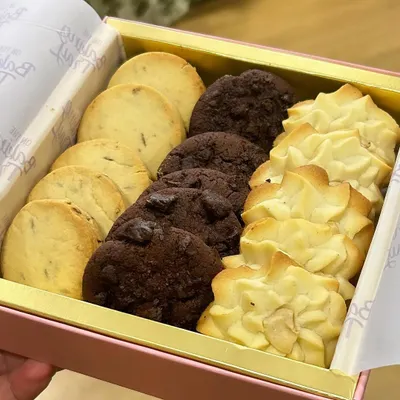 A box full of my favorite cookies. This assorted cookie box includes a variety of my eggless classics, from buttery shortbread to double chocolate chip, perfect for any occasion.