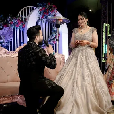 The classic proposal moment. We capture the groom on one knee during the ring ceremony, a pinnacle of romance and commitment.