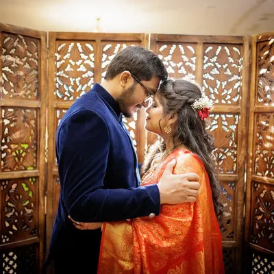 An intimate moment between a couple after their court marriage, their foreheads touching in a gesture of love.