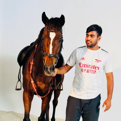 A quiet moment with our competition horse, Candy. We believe a strong, respectful bond with the horse is the most important part of being an equestrian.