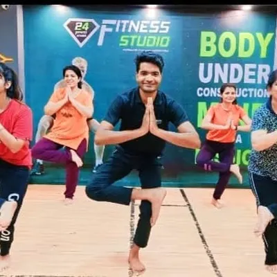 Leading a group of enthusiastic students in Vrikshasana (Tree Pose) at 24 Fitness Studio in Malviya Nagar, Delhi. The collective energy helps everyone stay motivated.