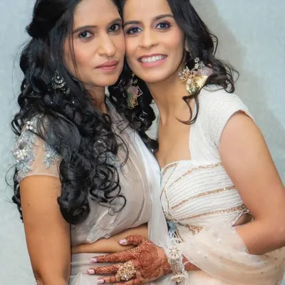A beautiful moment between two clients. I created coordinated subtle glam looks for them, focusing on soft curls and makeup that feels light and looks effortlessly elegant.