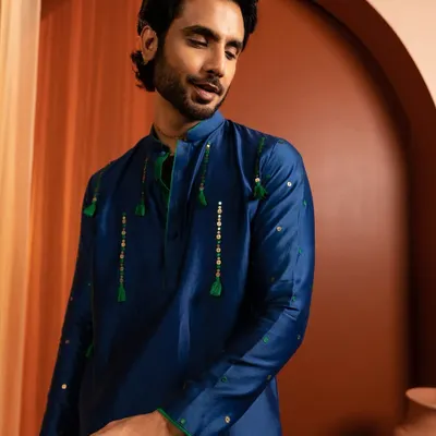 A clean and natural grooming look for a Kaaj Button Studio campaign. The focus is on evening out the skin tone and defining features subtly for a polished finish.