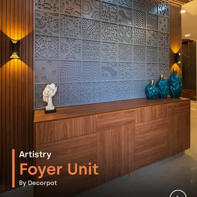 This artistry foyer unit is a true masterpiece. The intricate CNC-cut panel wall serves as a stunning backdrop for the warm wood console, creating a sophisticated and welcoming first impression.