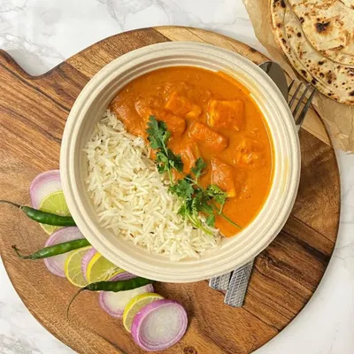 A perfect meal bowl of creamy Kadhai Paneer served with fluffy Jeera Rice. It's a complete and satisfying dinner, ready to be enjoyed.