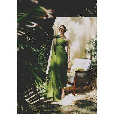 For the AVEKA 'Love Letter' campaign, I styled this elegant green one-shoulder gown in a lush garden setting. The play of sunlight and shadow through the leaves creates a natural, romantic atmosphere.