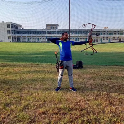 An archer takes aim with a compound bow during a practice session on our open field. I provide coaching that focuses on proper form, safety, and aiming techniques for both beginners and experienced archers.