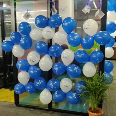 A simple and effective way to reinforce branding at a corporate event. This balloon wall for TAC Security uses their brand colors and features their logo printed directly on the balloons, creating a professional and festive atmosphere.