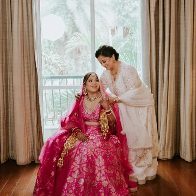 A sweet moment between the bride and her mother. For the mom, I created a soft, elegant look with a focus on fresh skin and subtle definition to complement her beautiful white outfit.