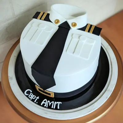 Let your dreams take flight! This pilot uniform cake is all about clean lines and professional pride. The crisp white shirt, black tie, and detailed epaulets are all handcrafted from fondant for a sharp, impressive finish.