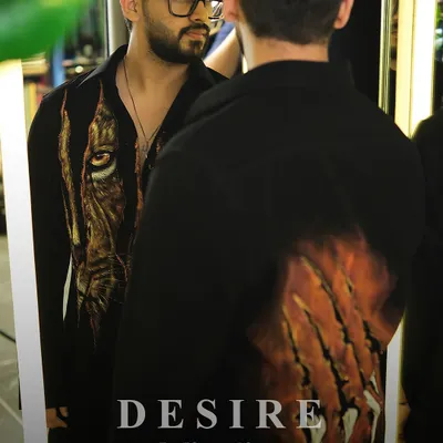 A reflection of inner strength. I designed this shirt with a dual-sided tiger motif, featuring a piercing eye on the front and claw marks on the back. It is a piece of wearable art for the man who is fierce from every angle.
