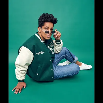 Styling for men is about capturing an attitude. For this model's portfolio, I created a cool, collegiate look with a classic varsity jacket, casual denim, and sleek sunglasses that feels both current and timeless.