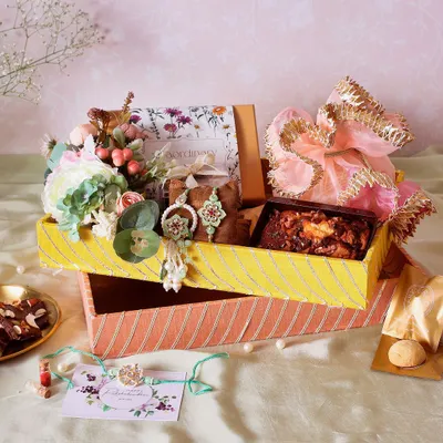 This Traditional Gota Tray Rakhi Hamper is not just about the treats inside, but the beautiful presentation that makes the gift feel truly special.