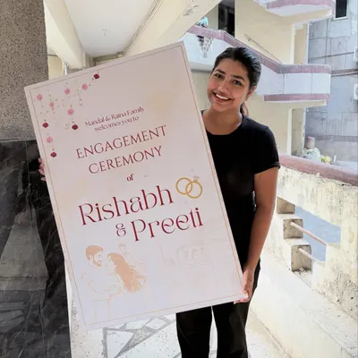 A large, elegant welcome sign is the first thing your guests see. This one, for Rishabh and Preeti's engagement, features their names, a custom illustration, and a warm welcome message for their families.