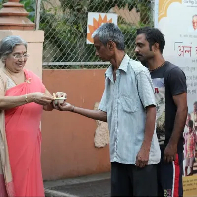 I personally participate in our Annam Brahma food service, offering a wholesome Sattvik meal. This act of 'Annadan' is rooted in the spirit of the Bhagavad Gita.