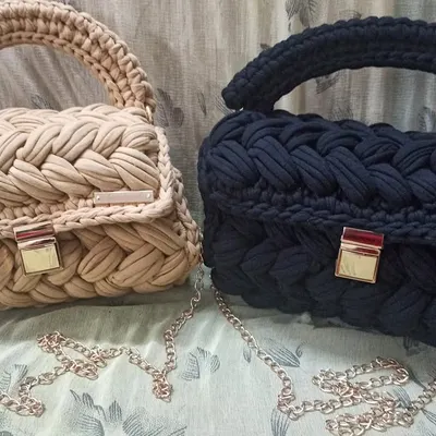 Here are two of my classic t-shirt yarn handbags side-by-side in beige and black. This shows how the same design looks in different versatile colors, both featuring a braided body and a gold-tone chain strap.
