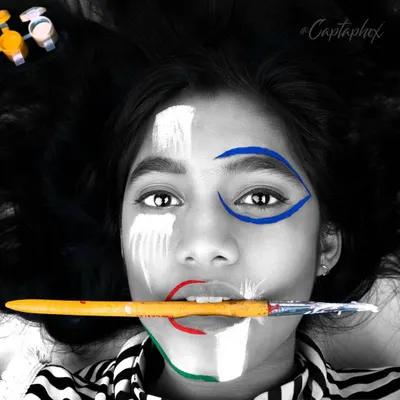 A striking black and white editorial portrait with selective color on the face paint. This high-concept image plays with contrast and focus, creating a memorable and artistic shot for a fashion story or a model's creative portfolio.