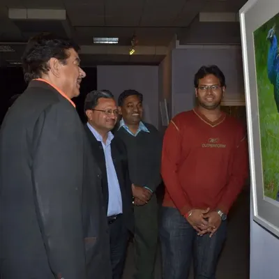 Here I am with the respected actor Shri Shatrughan Sinha, as he admires a photograph of a peacock at my "Jewels of the Wild" exhibition in 2012. It was a great honour to have him visit and appreciate my work.