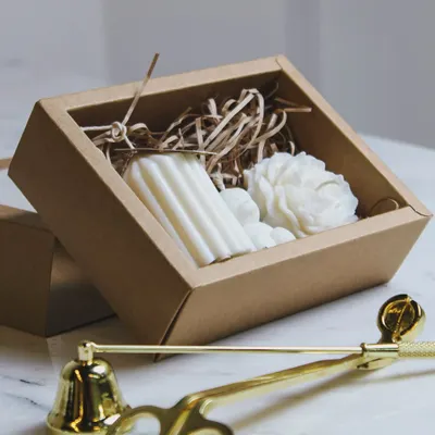 Gifting is my specialty, and I love putting together beautiful custom hampers. This gift box features a set of my molded candles, including a ribbed pillar and a flower design, nestled in a rustic box. It’s a perfect present for birthdays, weddings, or just because.